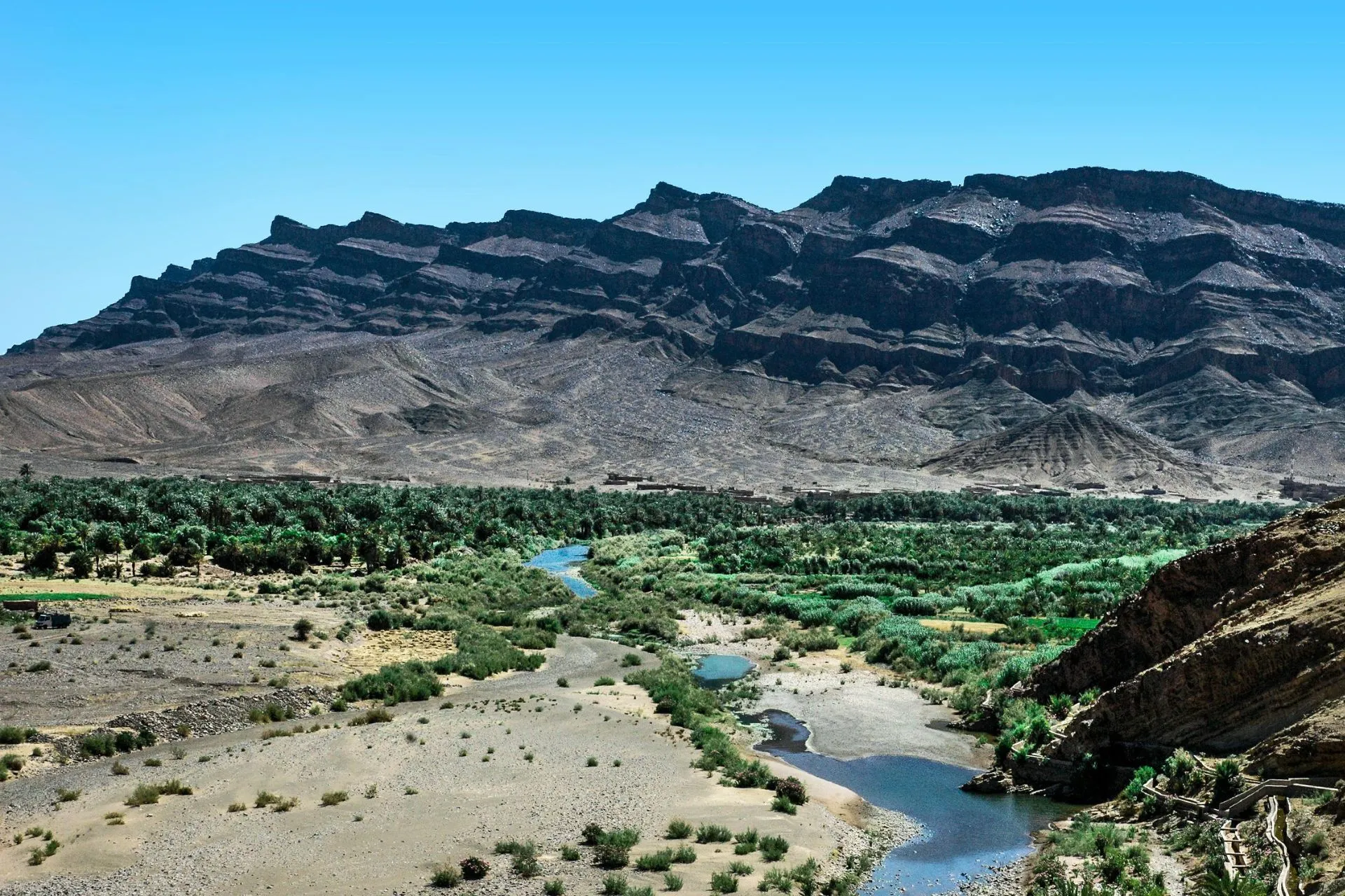 River near mountains in the Zagora Desert and Drâa Valley landscapes, Morocco