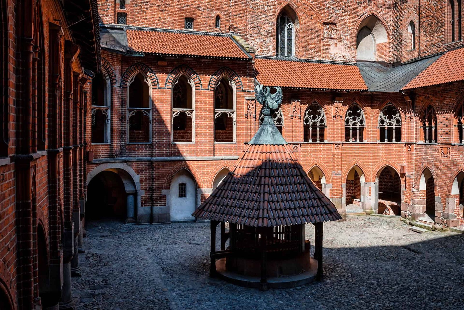 Interior Court of Malbork Castle, including its Old Gothic architecture halls of the Office and Archives, in Poland