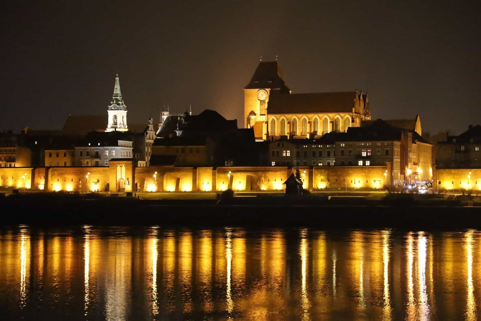Toruń Old Town at Night with the view on the Vistula River, Poland