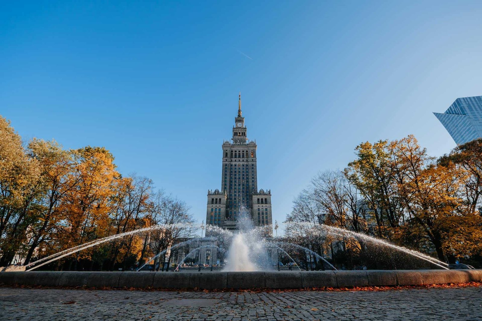 The Palace of Culture and Science with fountains, in Warsaw, Poland
