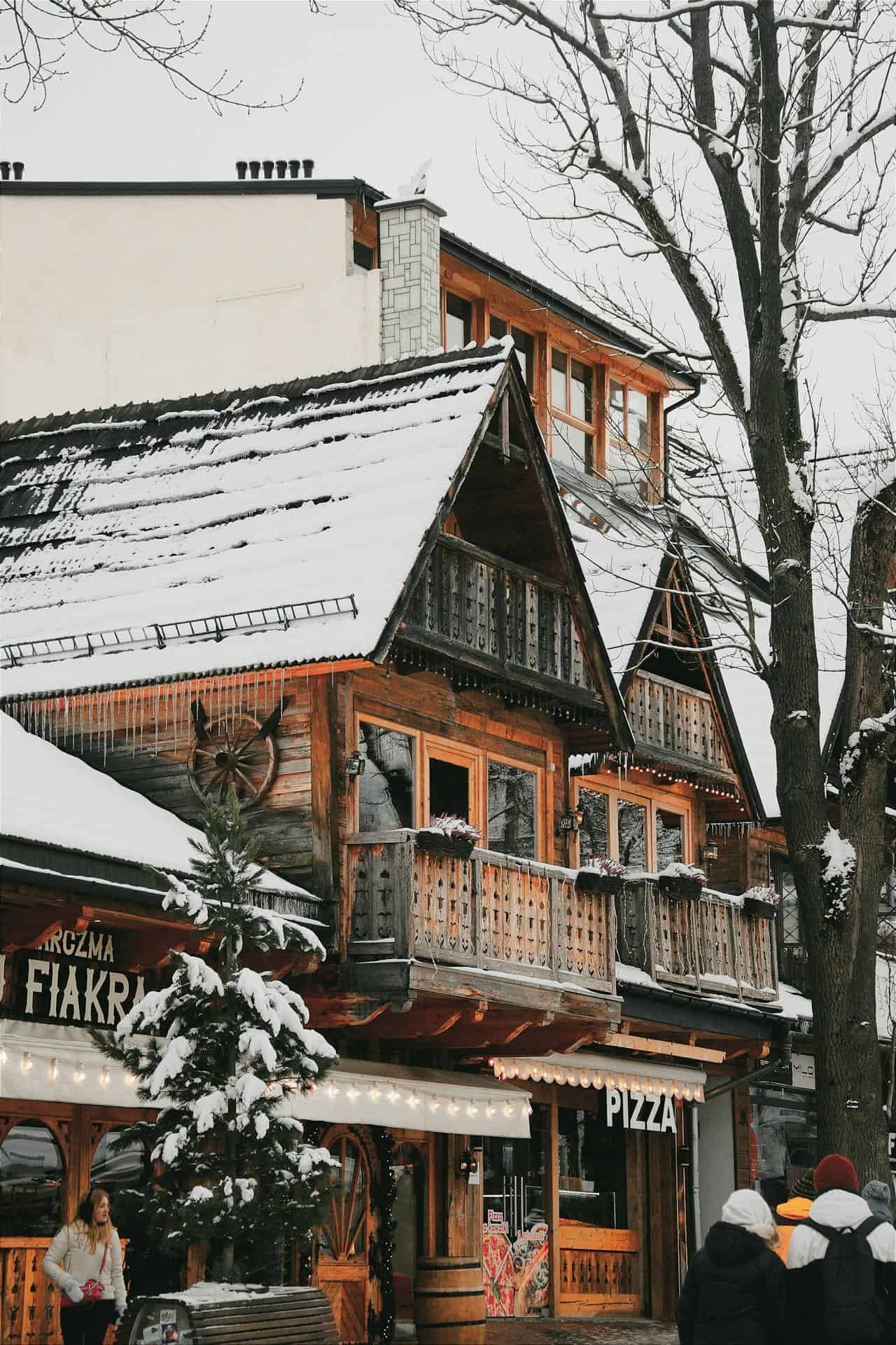 A view on a Wooden House in Winter at the Krupówki Street in Zakopane, Poland